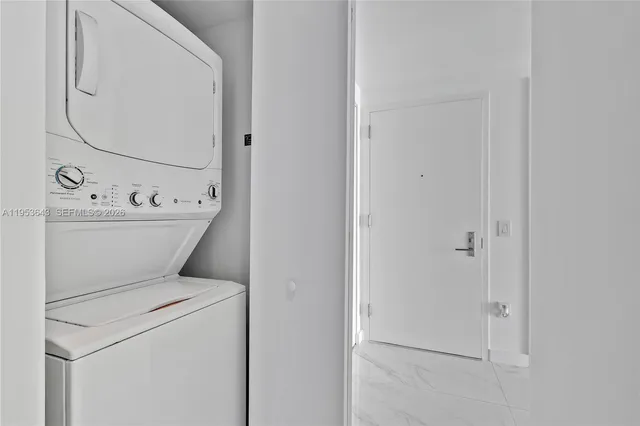 a view of an empty room with windows