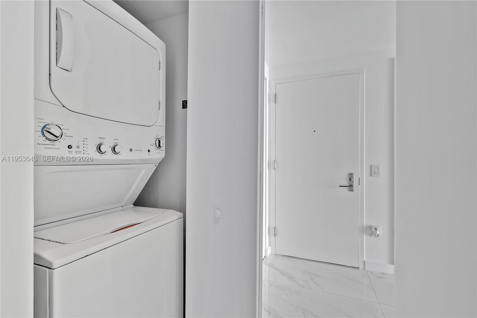 3131 Northeast 7th Avenue, Unit 3704 Miami, FL 33137 - Photo 30 of 61 a utility room with dryer and washer