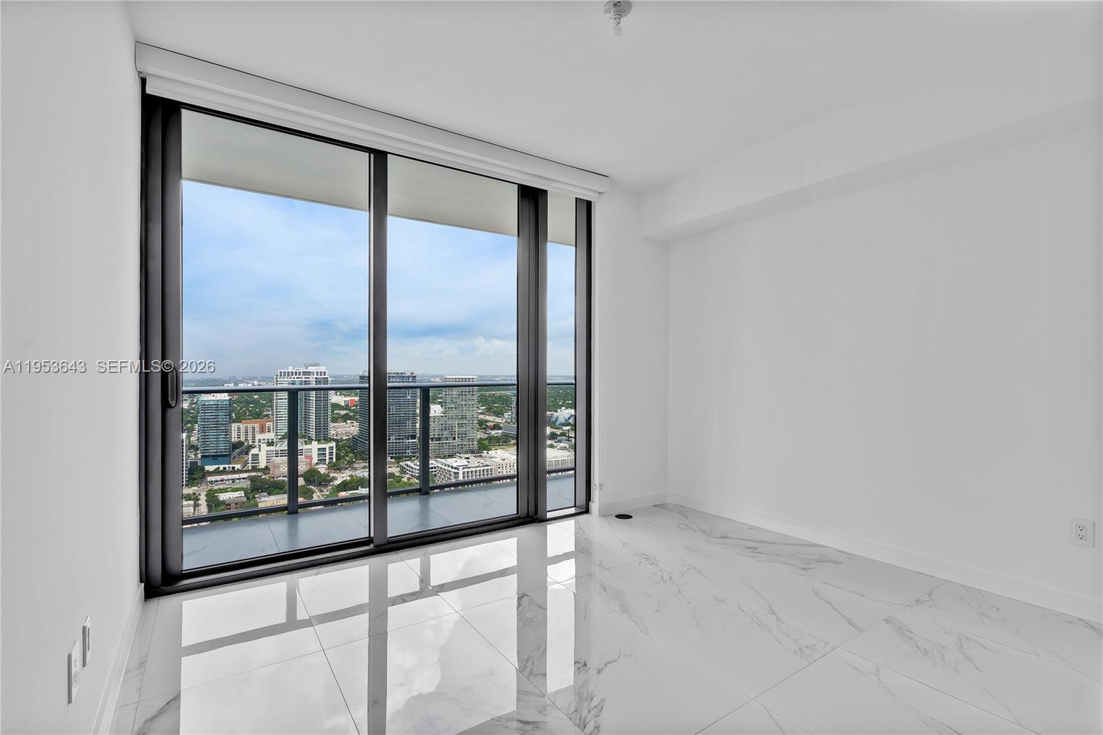 3131 Northeast 7th Avenue, Unit 3704 Miami, FL 33137 - Photo 33 of 61 a view of an empty room with a window