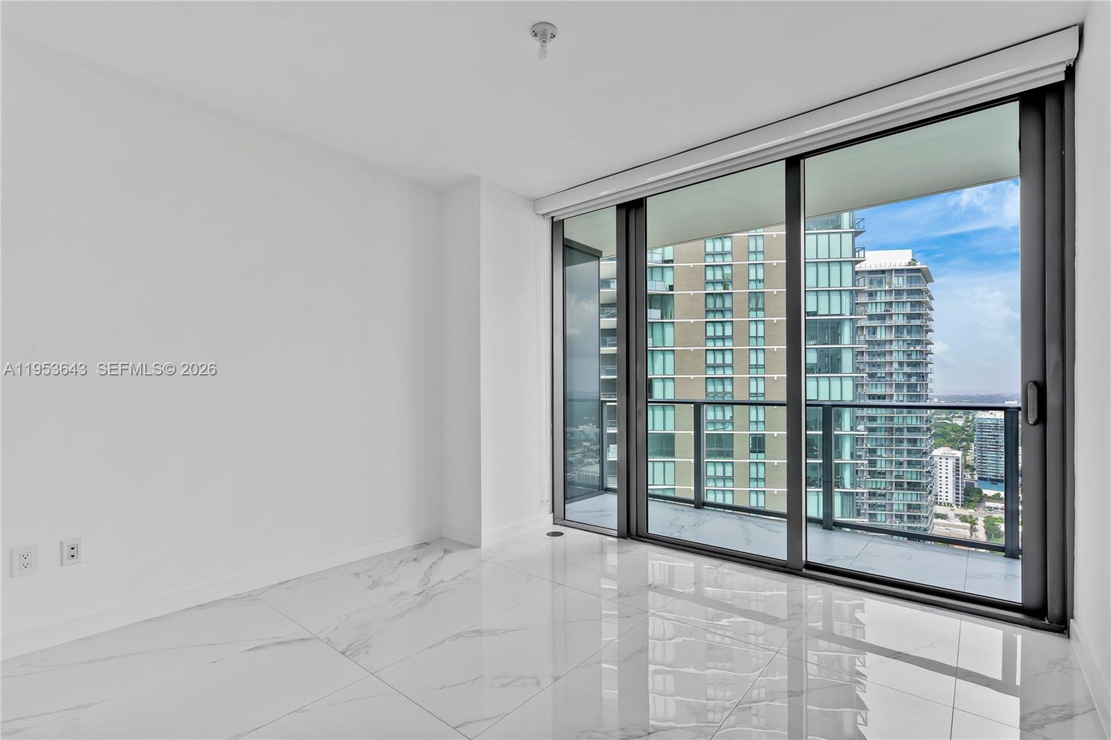 3131 Northeast 7th Avenue, Unit 3704 Miami, FL 33137 - Photo 36 of 61 a view of an empty room with windows