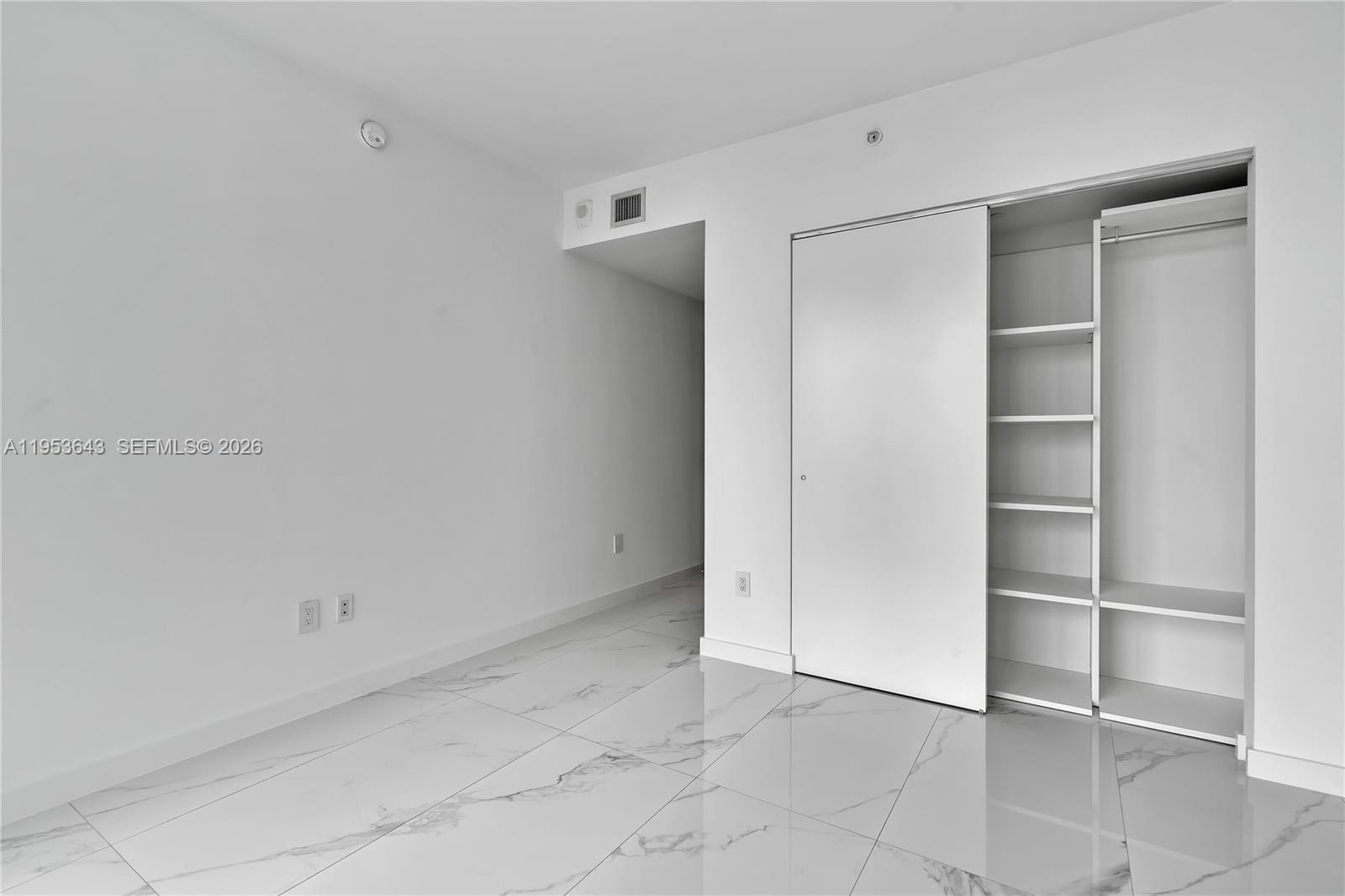 3131 Northeast 7th Avenue, Unit 3704 Miami, FL 33137 - Photo 38 of 61 a view of an empty walk in closet
