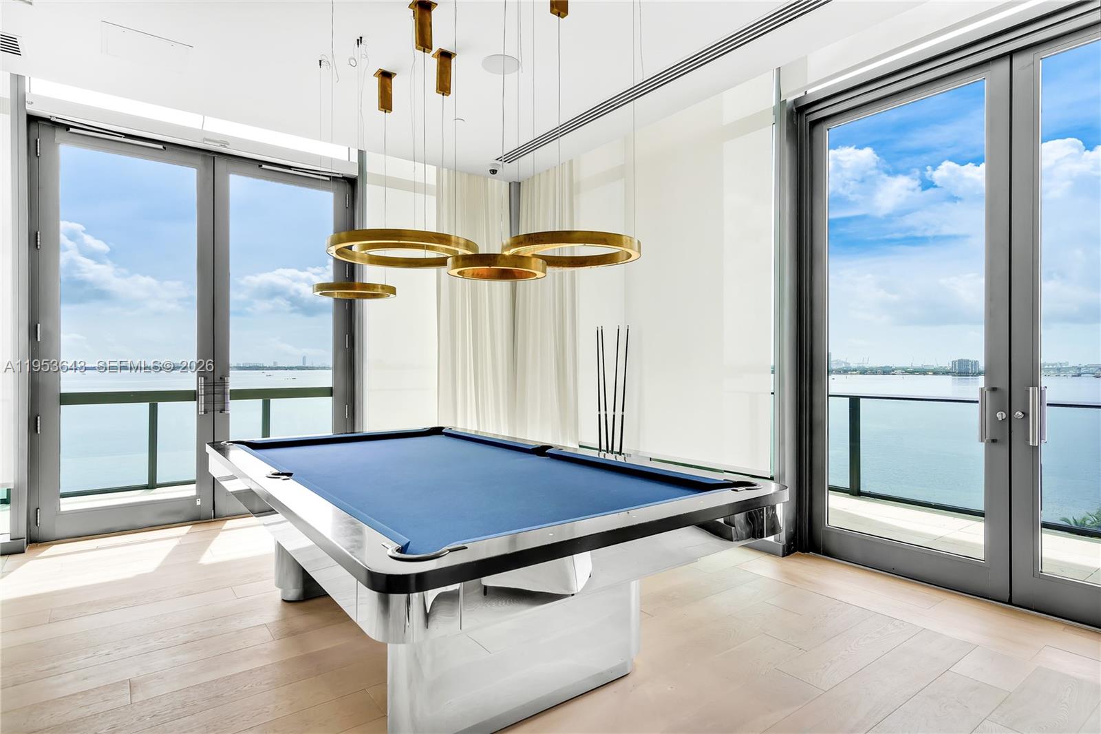 3131 Northeast 7th Avenue, Unit 3704 Miami, FL 33137 - Photo 61 of 61 a room with pool table and a chandelier