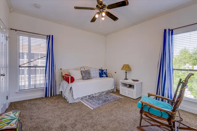 a bathroom with a granite countertop sink a toilet and a mirror