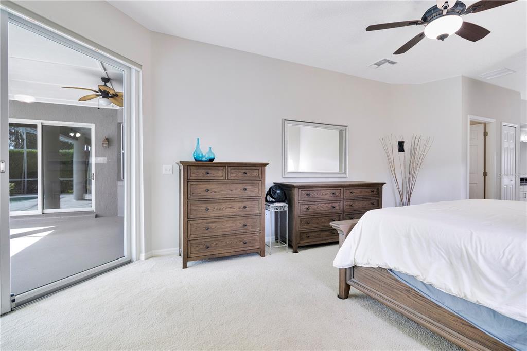 10216 Trout Road Orlando, FL 32836 - Photo 12 of 33 a bedroom with a bed and a cabinets