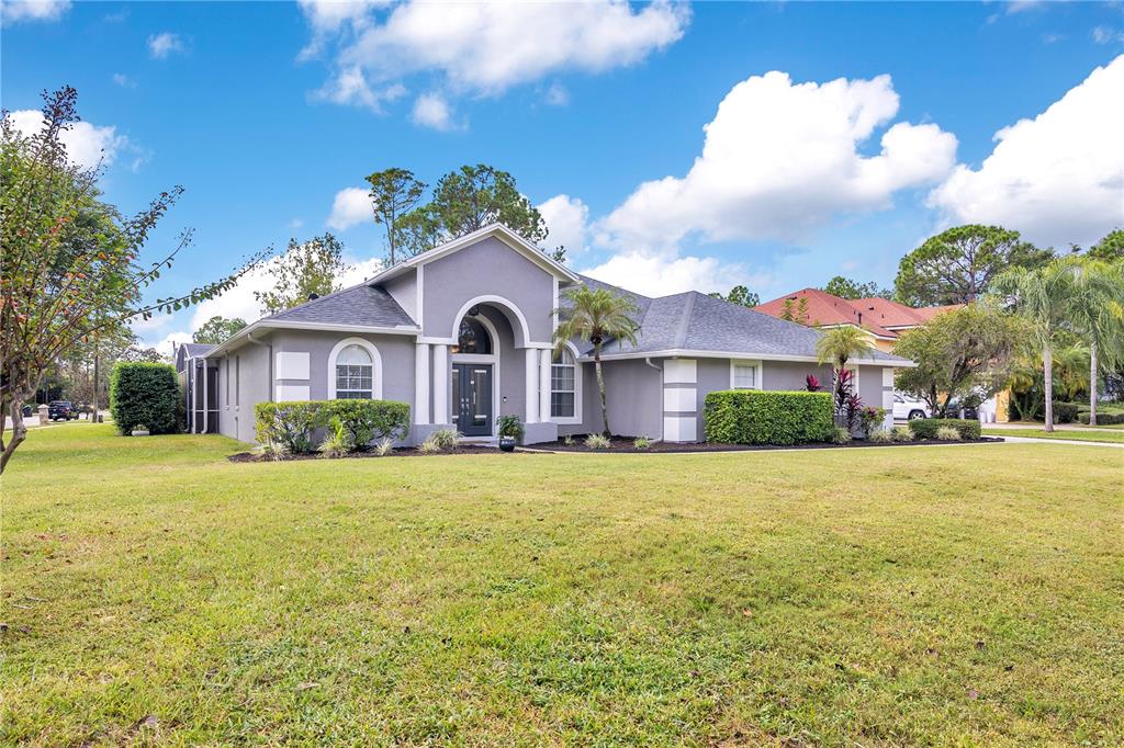10216 Trout Road Orlando, FL 32836 - Photo 2 of 33 a front view of a house with a yard