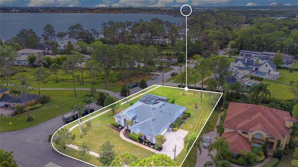 10216 Trout Road Orlando, FL 32836 - Photo 26 of 33 an aerial view of a house with a garden and lake view