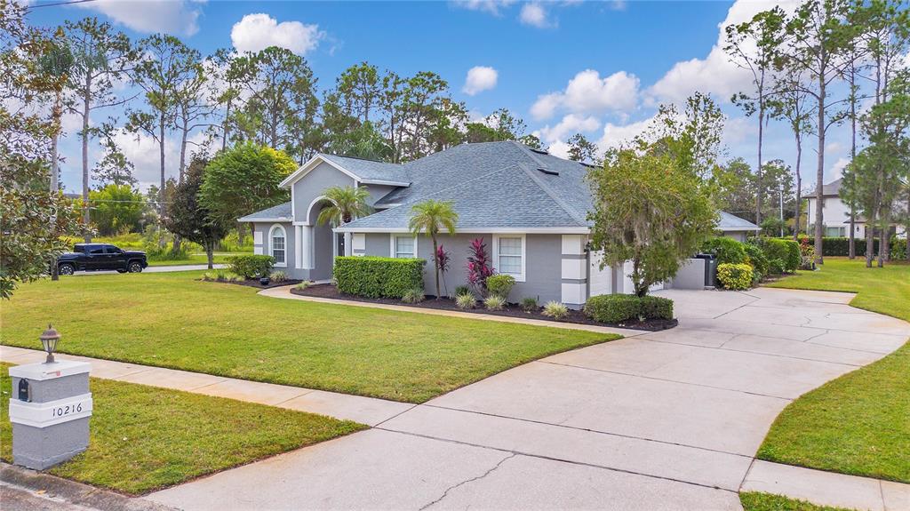 10216 Trout Road Orlando, FL 32836 - Photo 3 of 33 a front view of a house with a yard