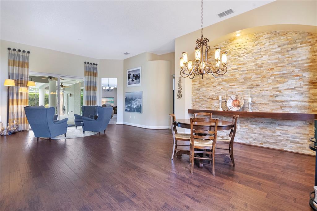 10216 Trout Road Orlando, FL 32836 - Photo 5 of 33 a dining room with furniture window and wooden floor