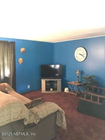 a view of a hallway with two couches and a coffee table