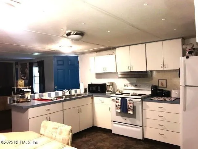 a kitchen with a stove and a refrigerator
