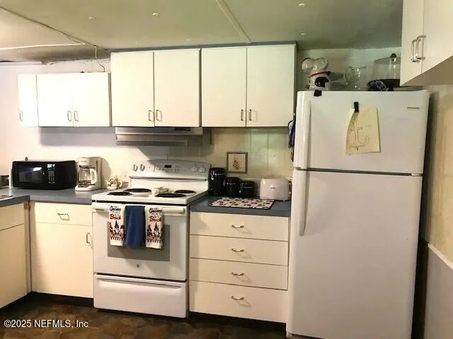 a view of a hallway with wooden floor and stairs