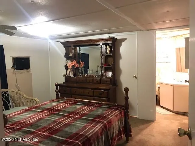 a bedroom with a bed and closet