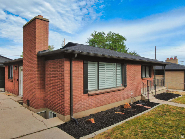 3138 Jean Street Magna, UT 84044 - Photo 3 of 26 Brick exterior featuring a prominent chimney
