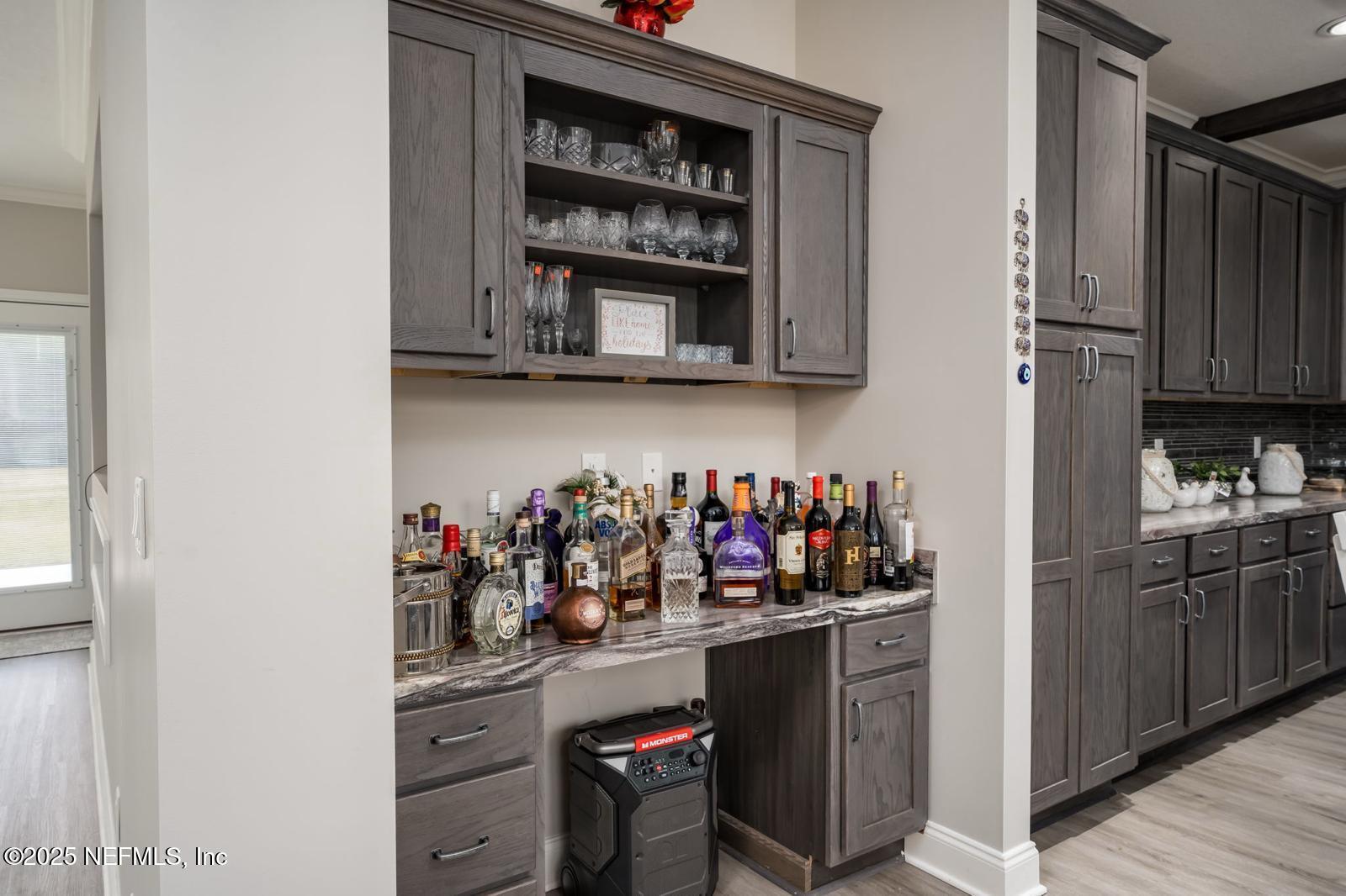 6529 County Road 121 Bryceville, FL 32009 - Photo 13 of 39 a kitchen with refrigerator and cabinets