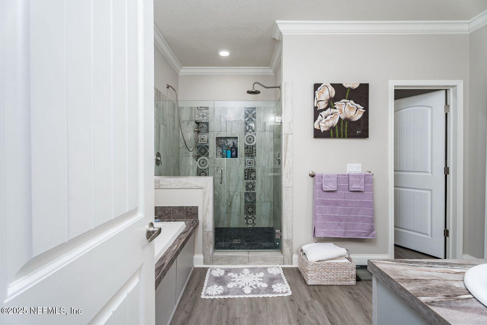 6529 County Road 121 Bryceville, FL 32009 - Photo 17 of 39 a bathroom with a bathtub a sink and a shower