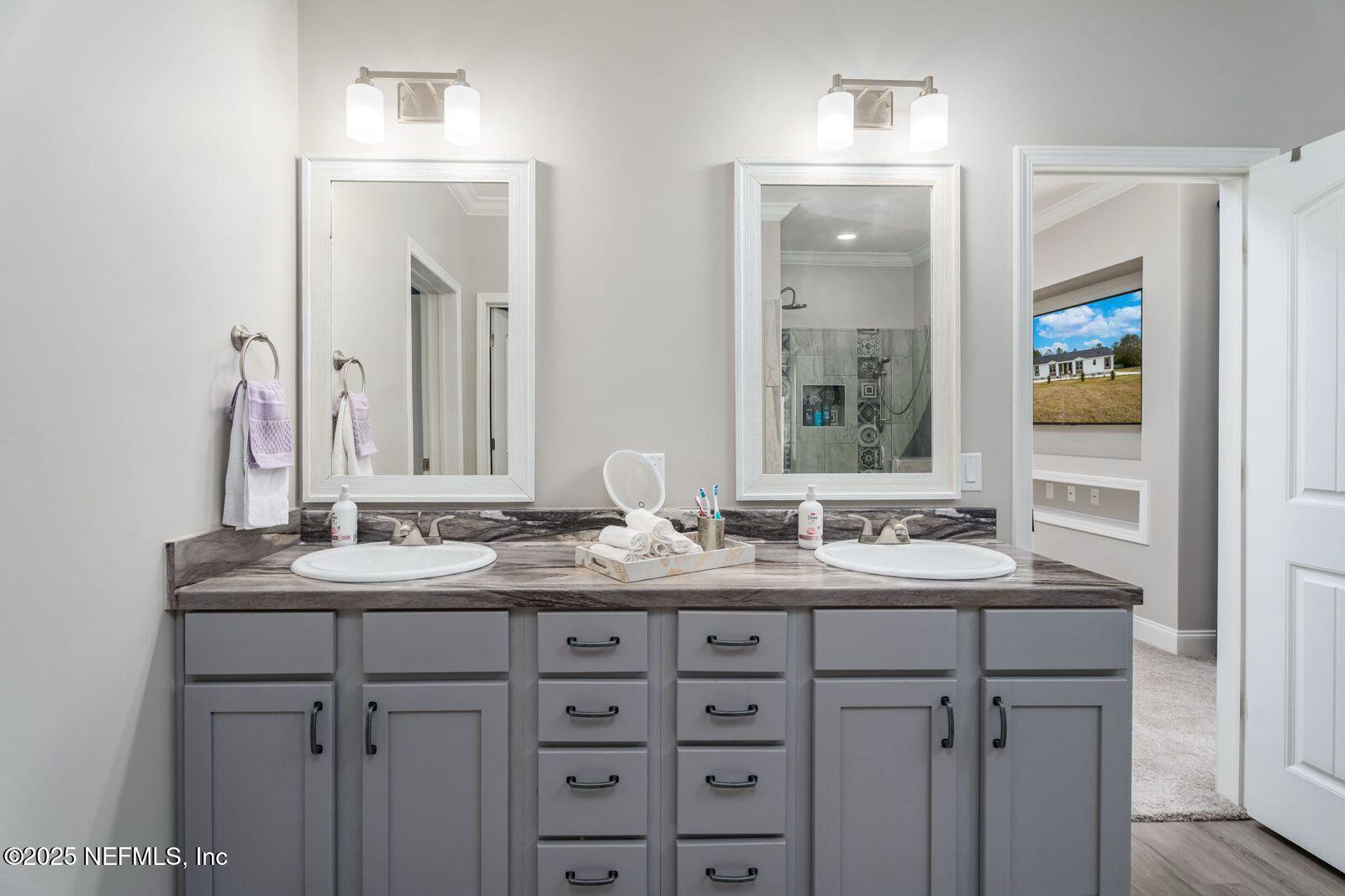6529 County Road 121 Bryceville, FL 32009 - Photo 18 of 39 a bathroom with a sink and a mirror