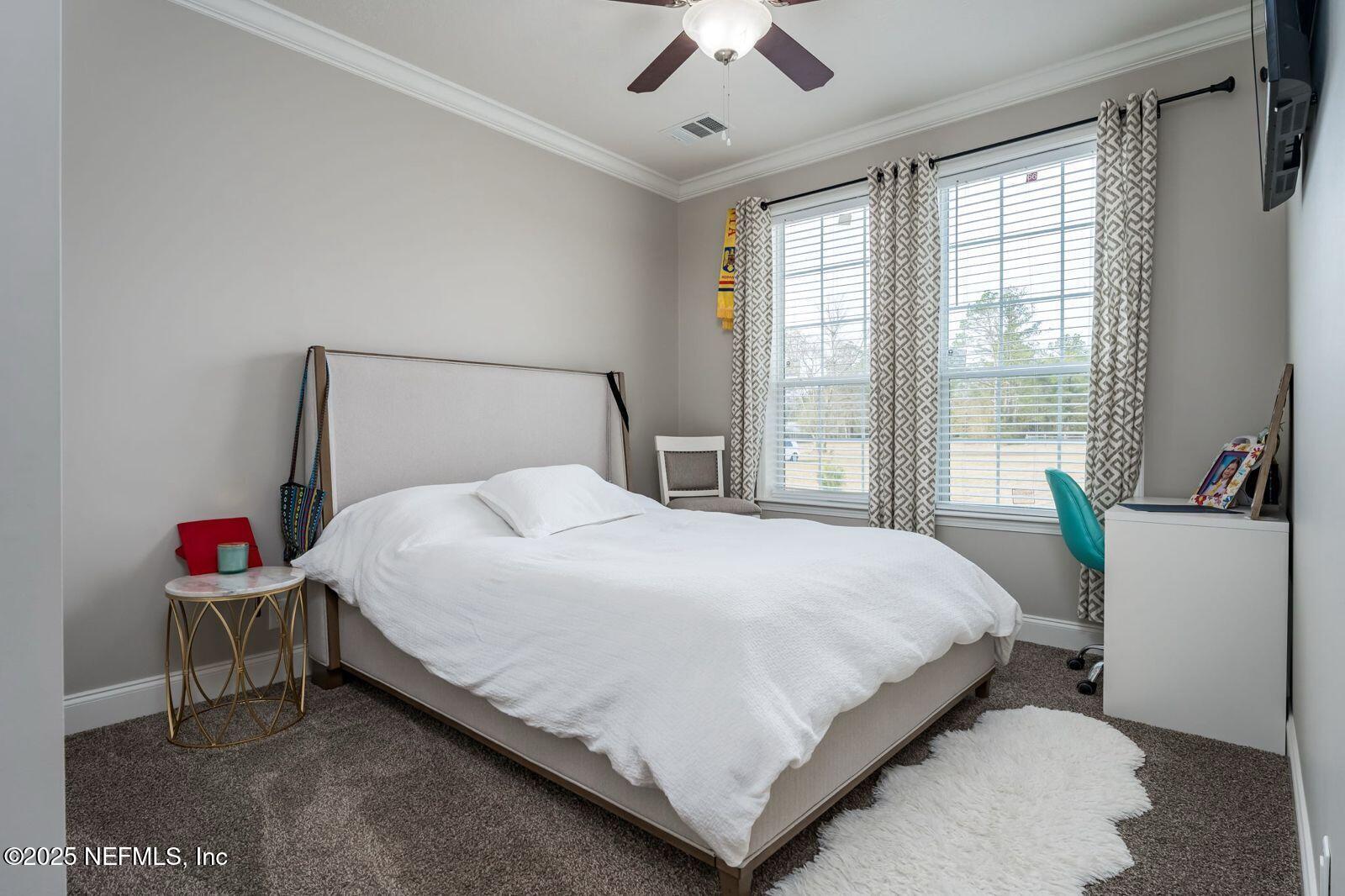 6529 County Road 121 Bryceville, FL 32009 - Photo 19 of 39 a bedroom with a bed and window