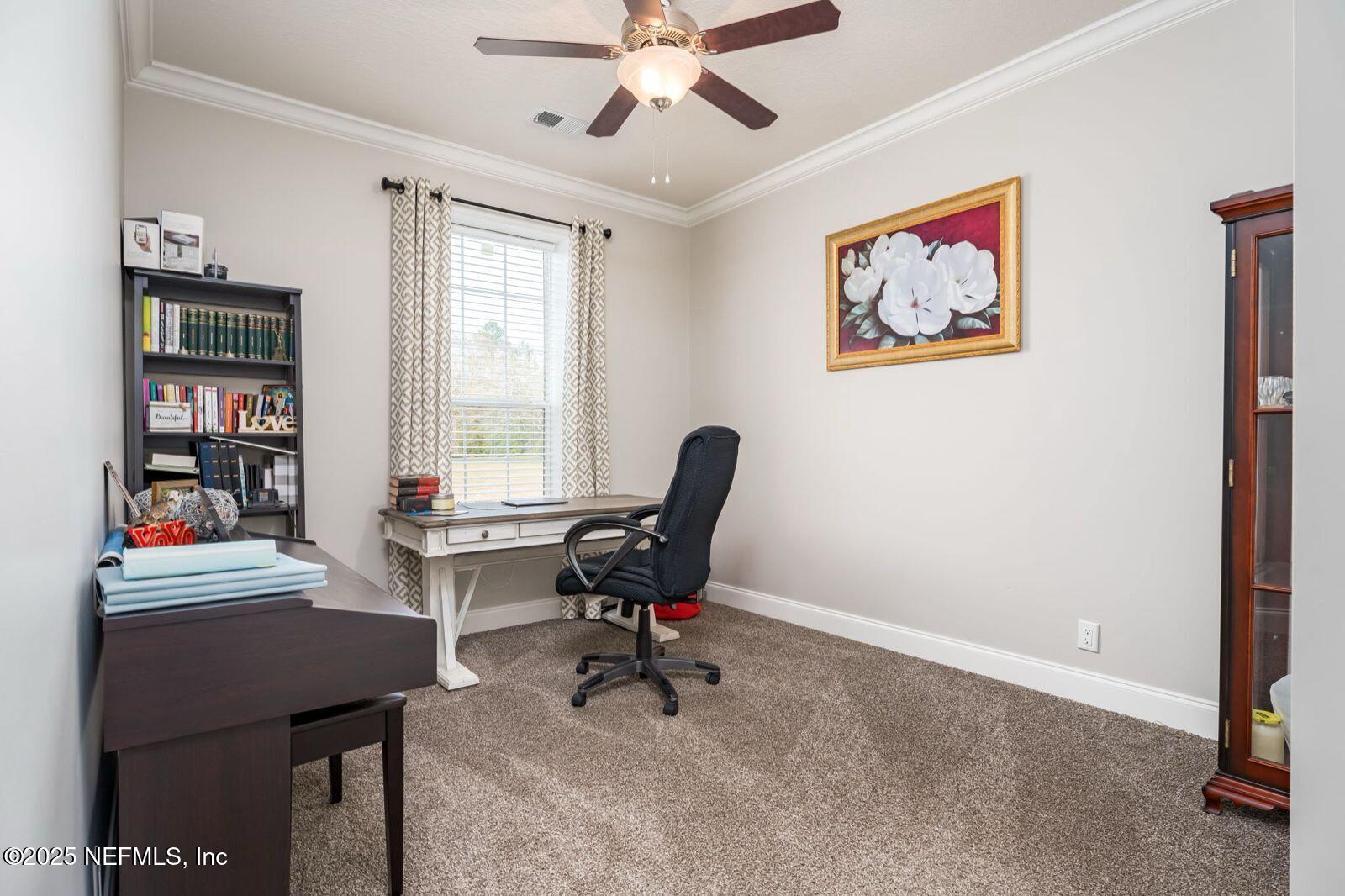 6529 County Road 121 Bryceville, FL 32009 - Photo 21 of 39 a work room with furniture and a window