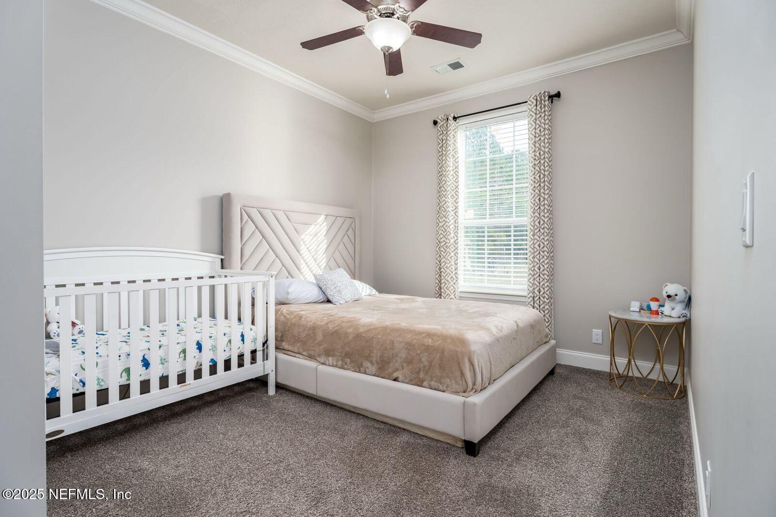 6529 County Road 121 Bryceville, FL 32009 - Photo 23 of 39 a bed sitting in a room next to a window