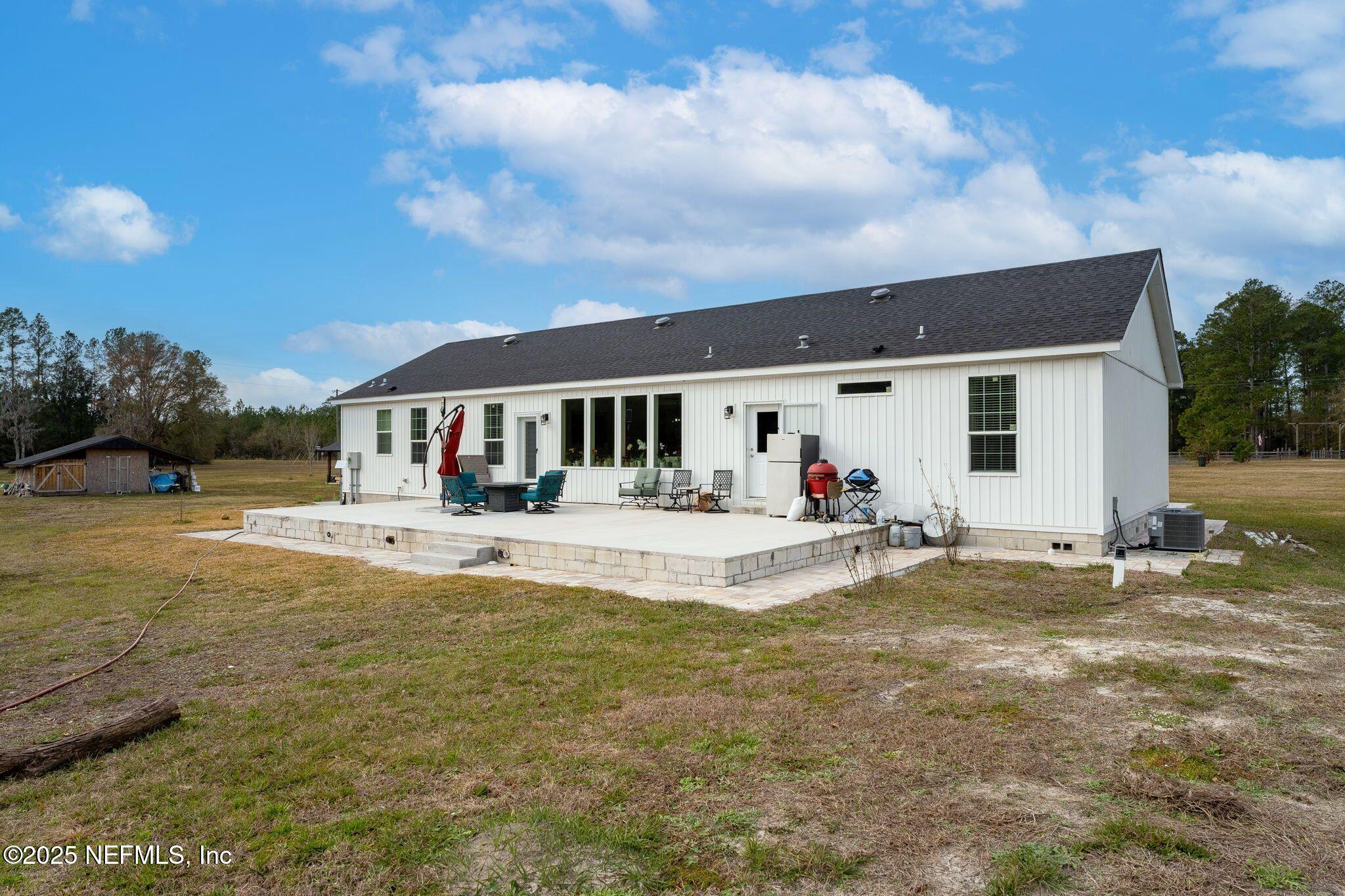 6529 County Road 121 Bryceville, FL 32009 - Photo 26 of 39 a view of swimming pool with outdoor seating and deck in back
