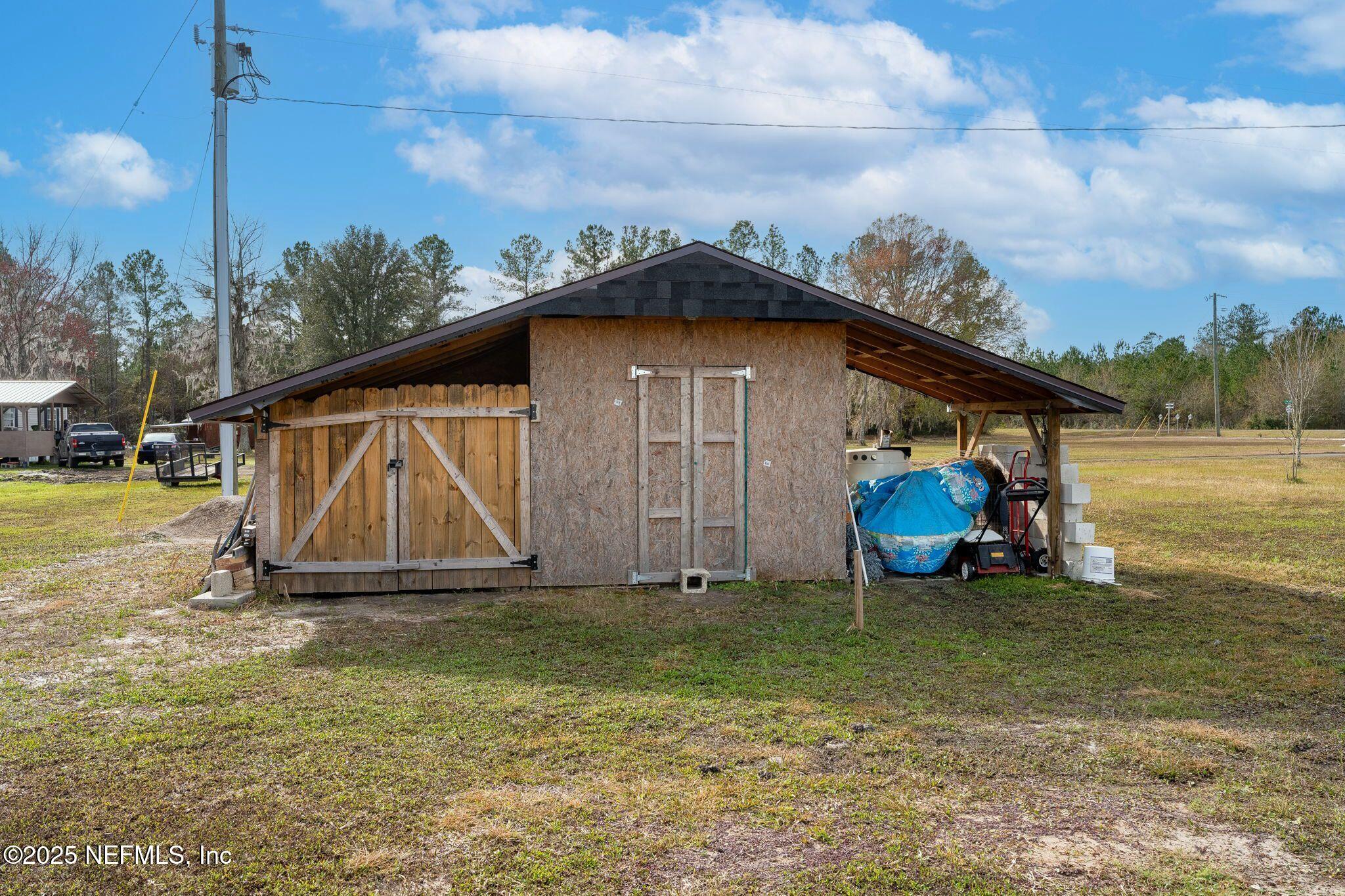 6529 County Road 121 Bryceville, FL 32009 - Photo 29 of 39 a view of a house with backyard