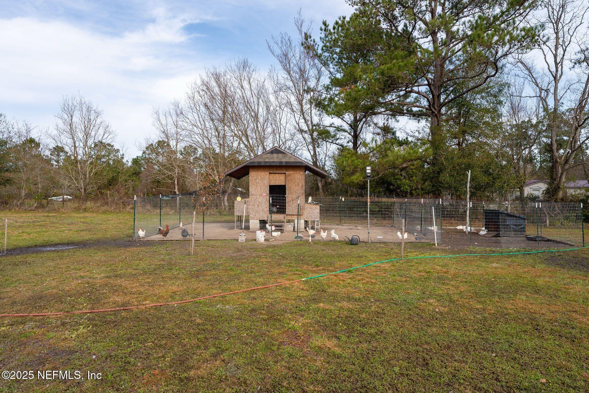 6529 County Road 121 Bryceville, FL 32009 - Photo 31 of 39 a view of a house with yard and sitting area