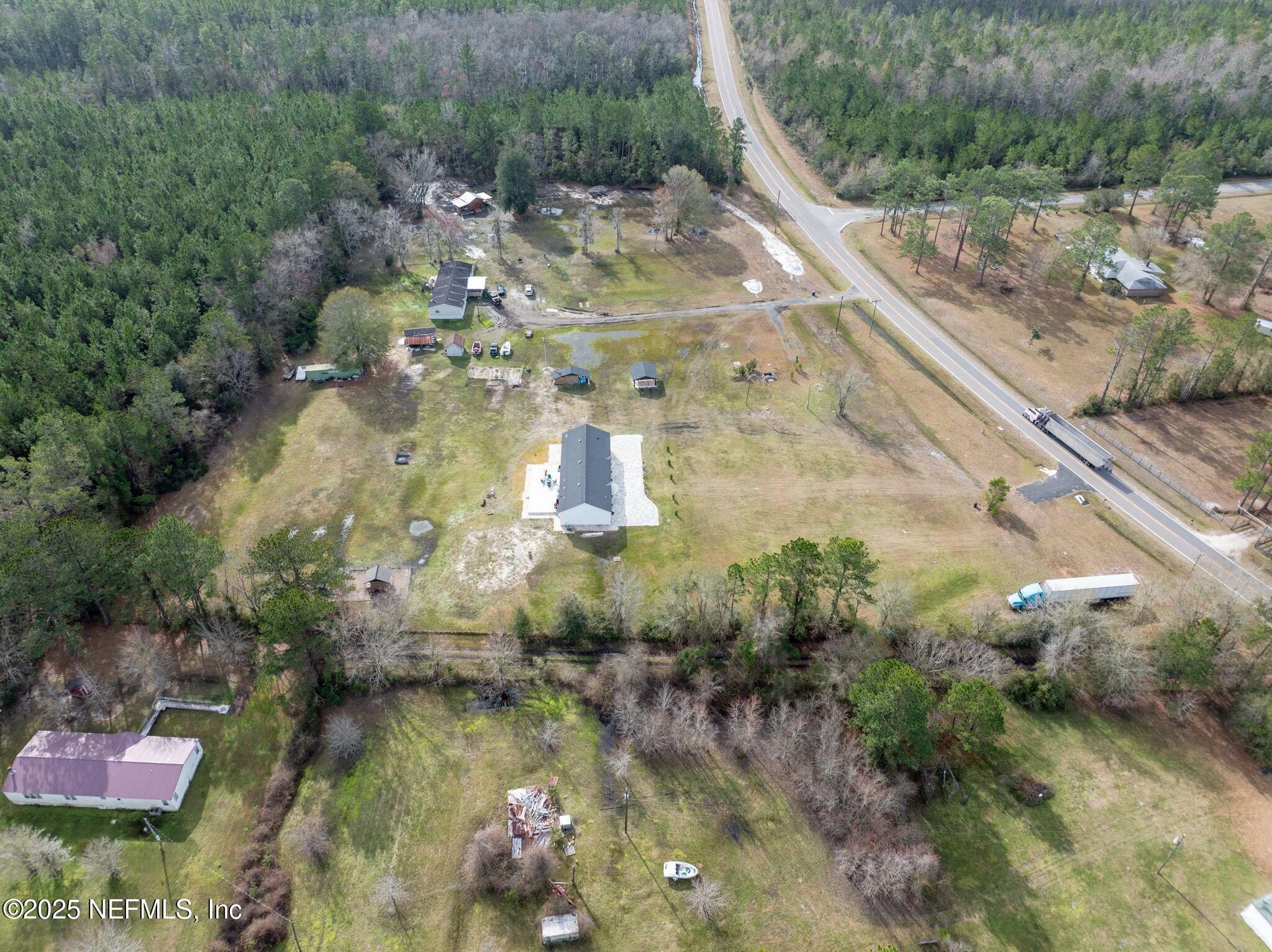 6529 County Road 121 Bryceville, FL 32009 - Photo 37 of 39 a view of swimming pool with a yard