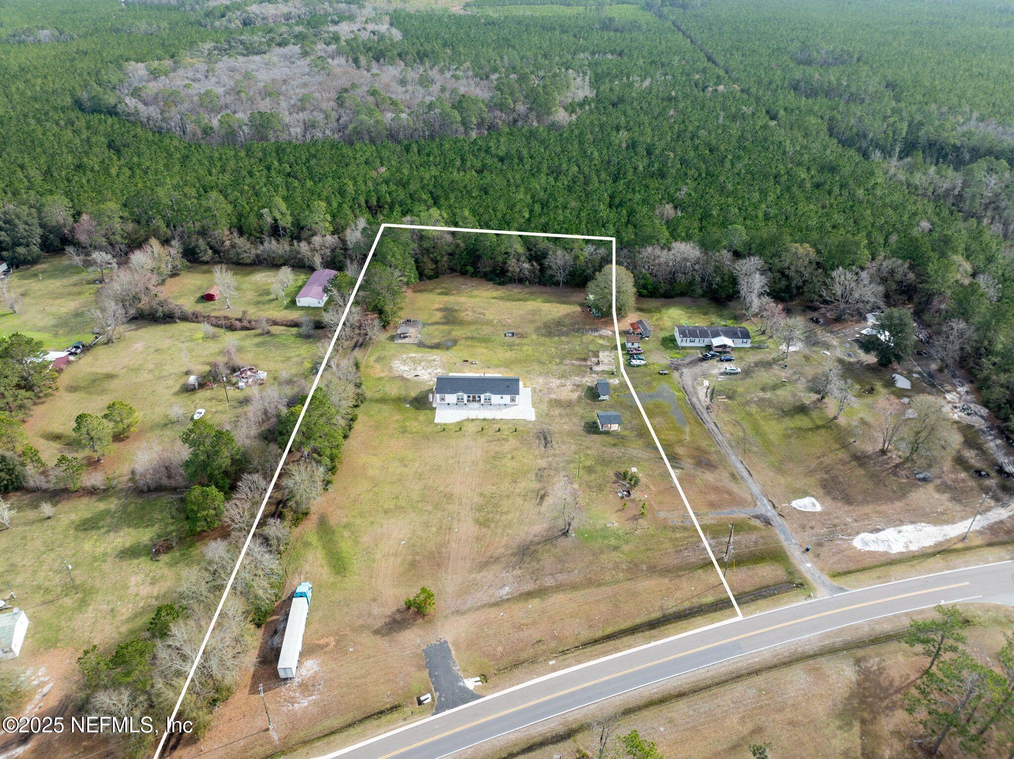 6529 County Road 121 Bryceville, FL 32009 - Photo 39 of 39 a view of swimming pool with a yard