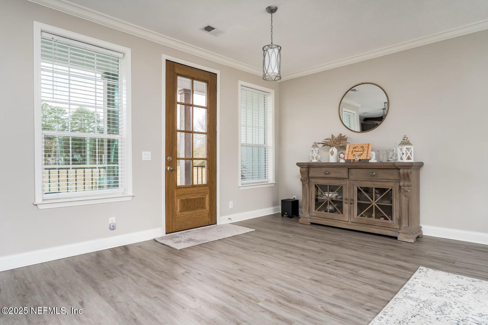 6529 County Road 121 Bryceville, FL 32009 - Photo 5 of 39 a view of a livingroom with furniture window and wooden floor
