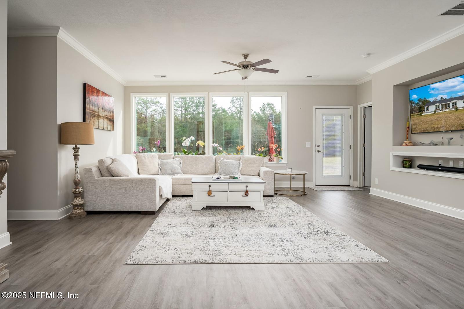 6529 County Road 121 Bryceville, FL 32009 - Photo 6 of 39 a living room with furniture and a large window