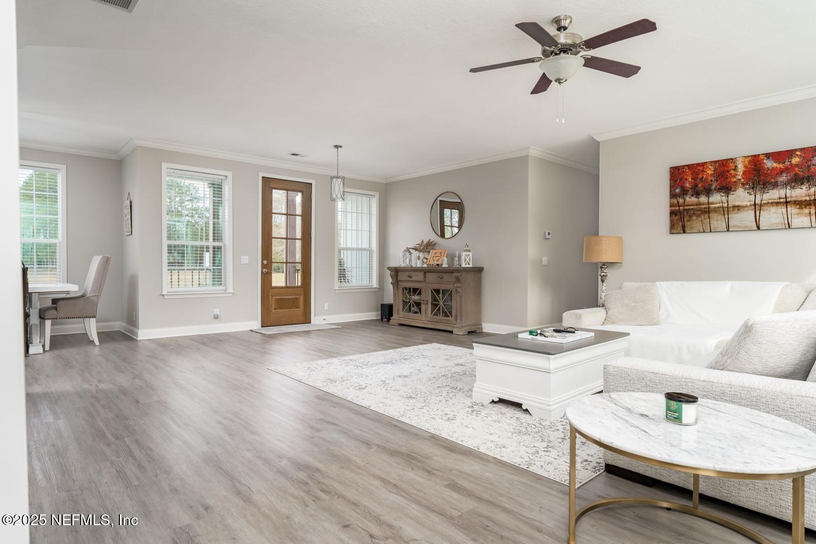 6529 County Road 121 Bryceville, FL 32009 - Photo 7 of 39 a living room with furniture and a wooden floor