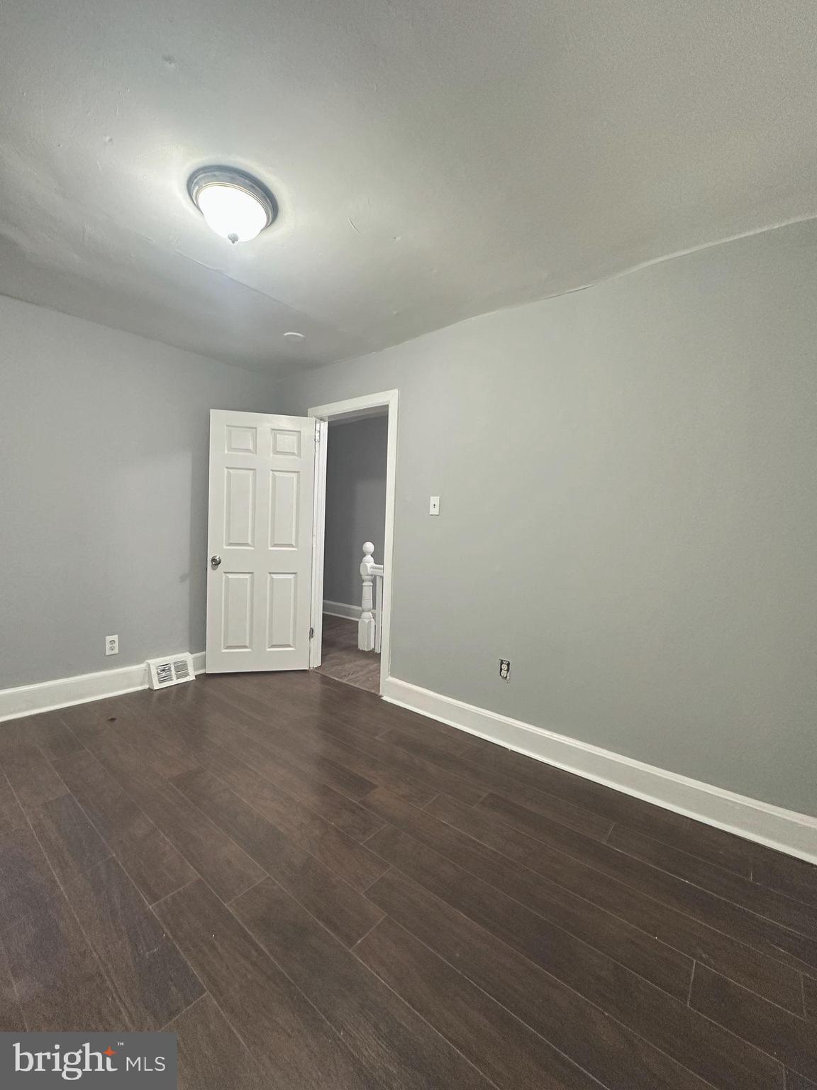 1109 Nottingham Way Hamilton, NJ 08609 - Photo 12 of 17 a view of an empty room with wooden floor