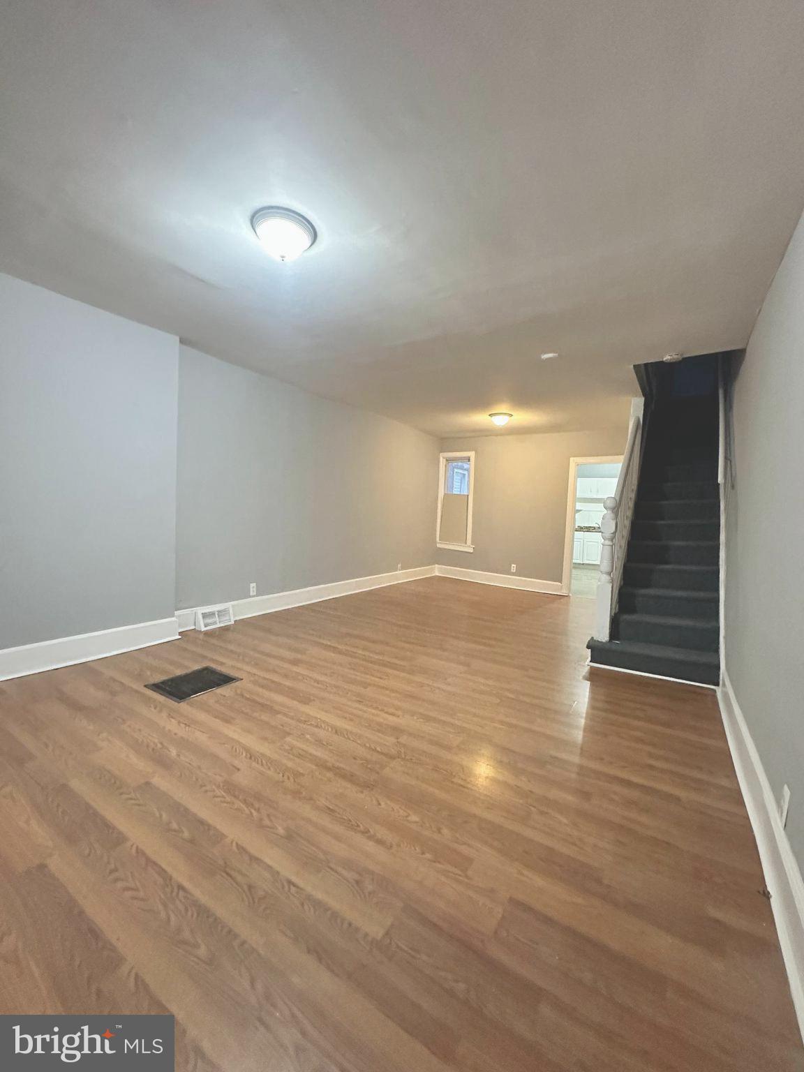 1109 Nottingham Way Hamilton, NJ 08609 - Photo 2 of 17 an empty room with wooden floor and windows