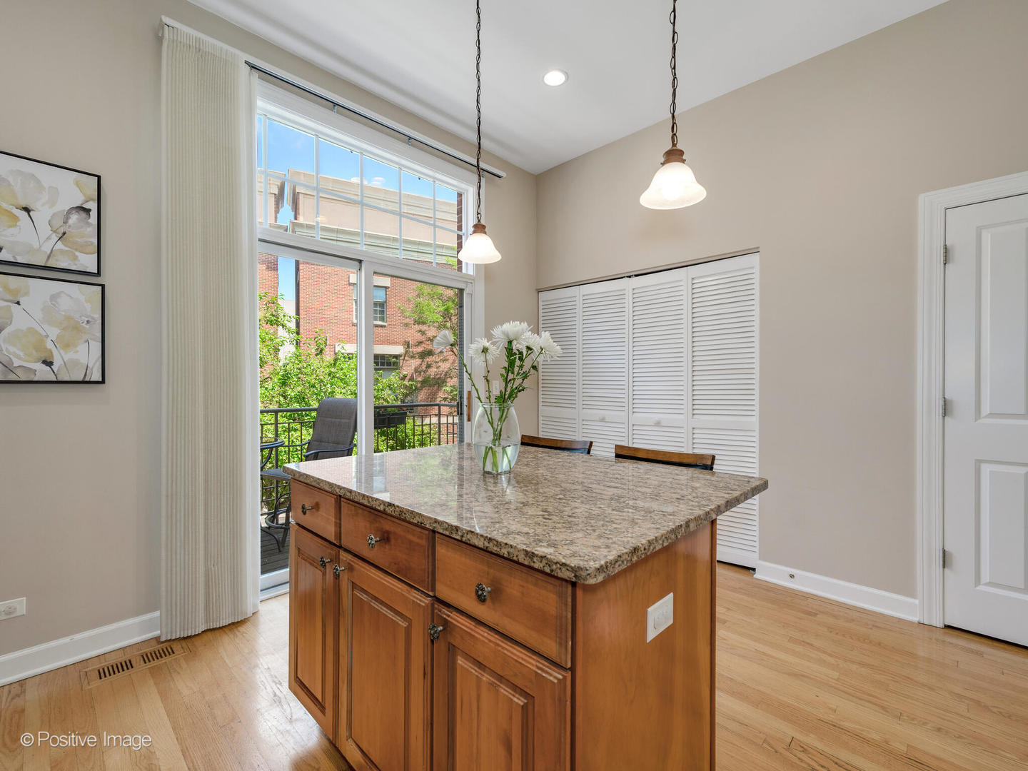 855 North May Street, Unit E Chicago, IL 60642 - Photo 11 of 30 a kitchen that has a counter space and a wooden floor