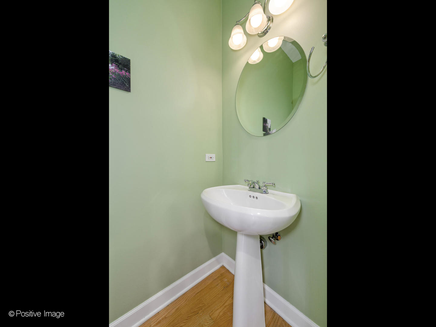 855 North May Street, Unit E Chicago, IL 60642 - Photo 13 of 30 a view of a bathroom with a sink and mirror
