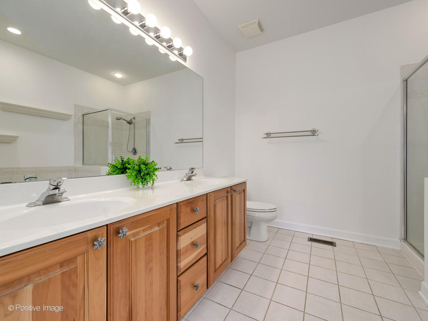 855 North May Street, Unit E Chicago, IL 60642 - Photo 15 of 30 a bathroom with a sink a toilet and a mirror