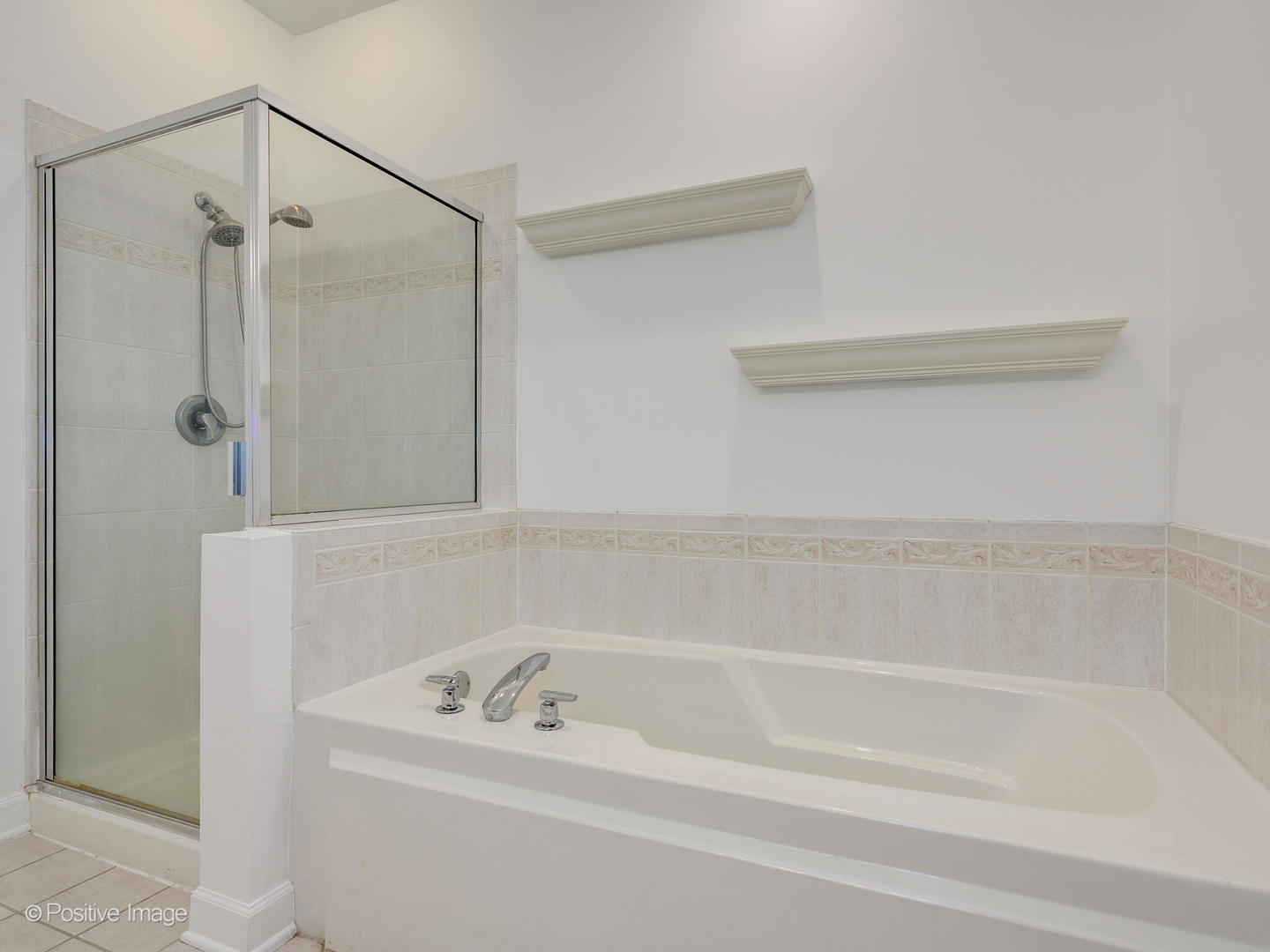 855 North May Street, Unit E Chicago, IL 60642 - Photo 16 of 30 a bathroom with a shower and a bath tub