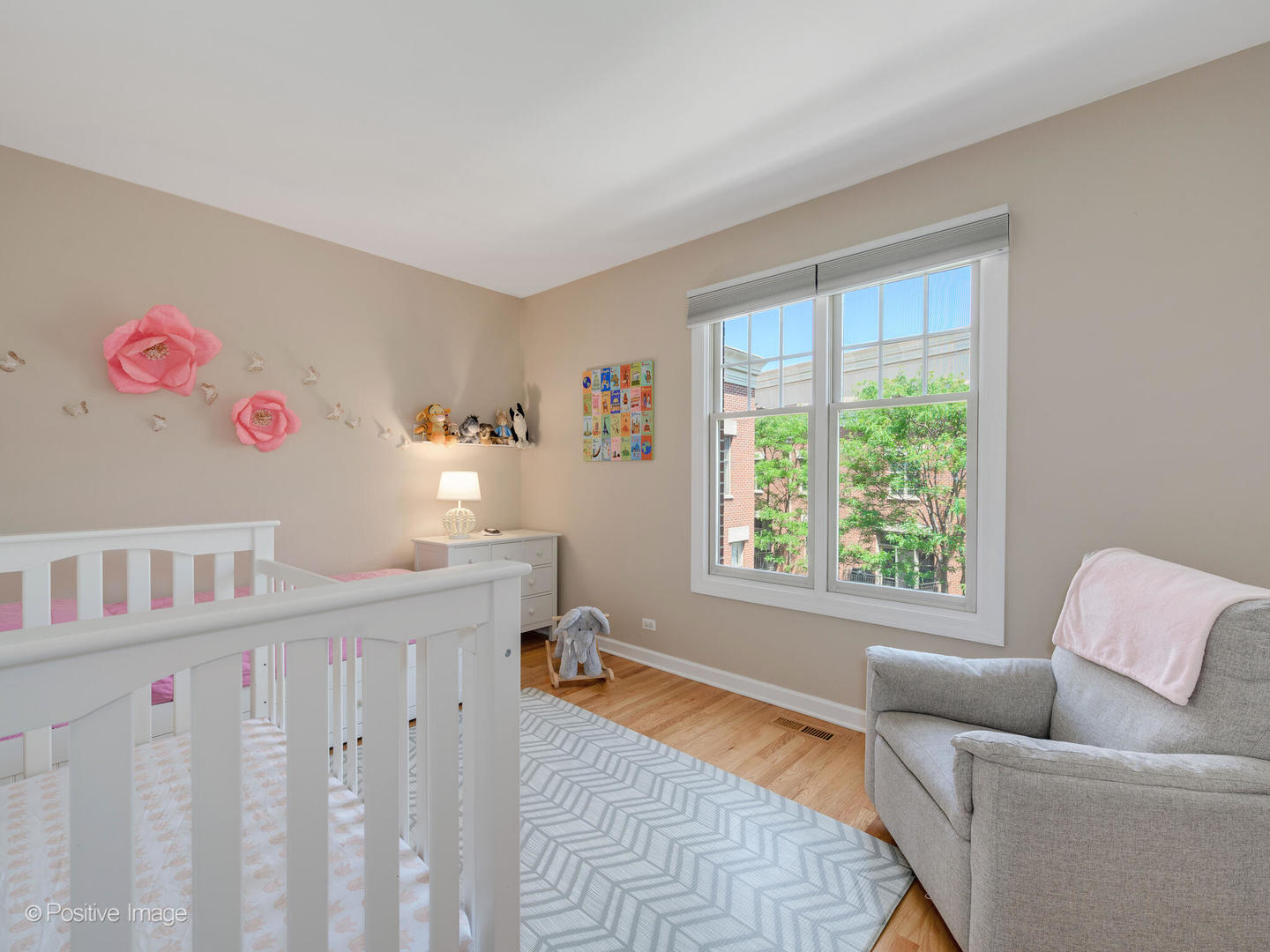 855 North May Street, Unit E Chicago, IL 60642 - Photo 17 of 30 a living room with furniture toys and a window