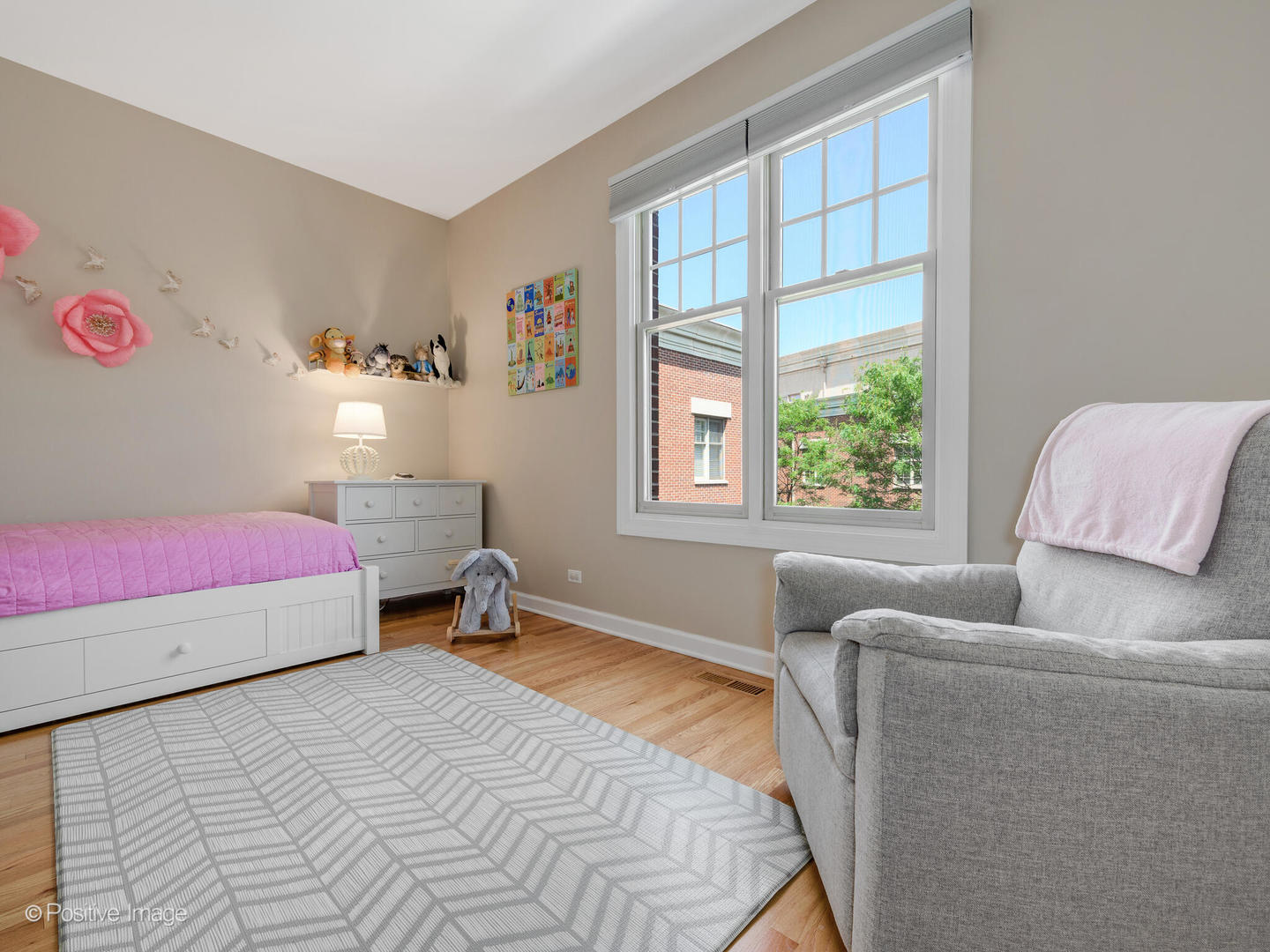 855 North May Street, Unit E Chicago, IL 60642 - Photo 18 of 30 a bedroom with a bed and a window