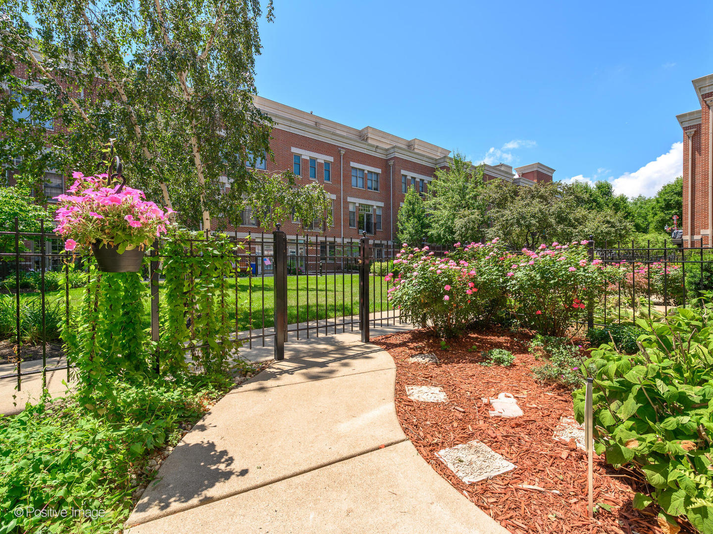 855 North May Street, Unit E Chicago, IL 60642 - Photo 25 of 30 a view of a garden with a building in the background
