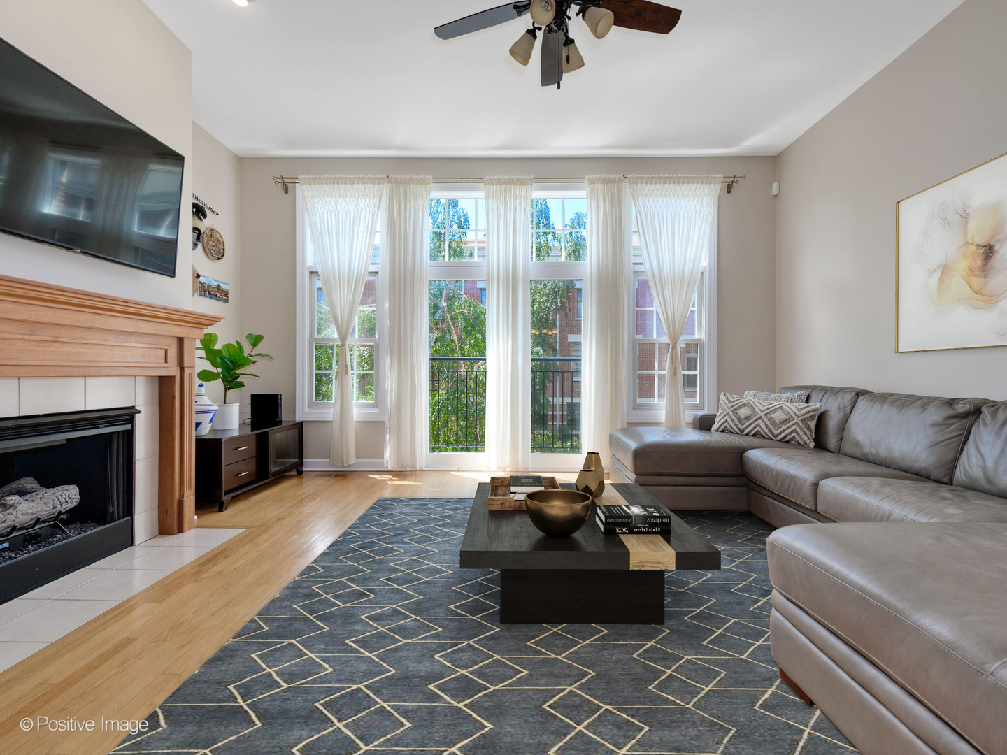 855 North May Street, Unit E Chicago, IL 60642 - Photo 3 of 30 a living room with furniture a flat screen tv and a fireplace