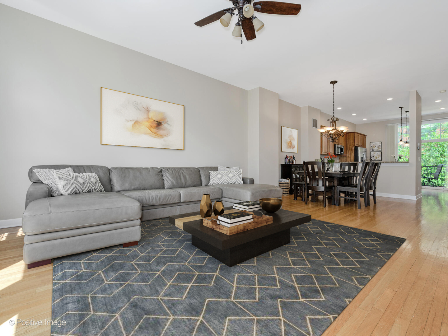 855 North May Street, Unit E Chicago, IL 60642 - Photo 4 of 30 a living room with furniture and a dining table with wooden floor