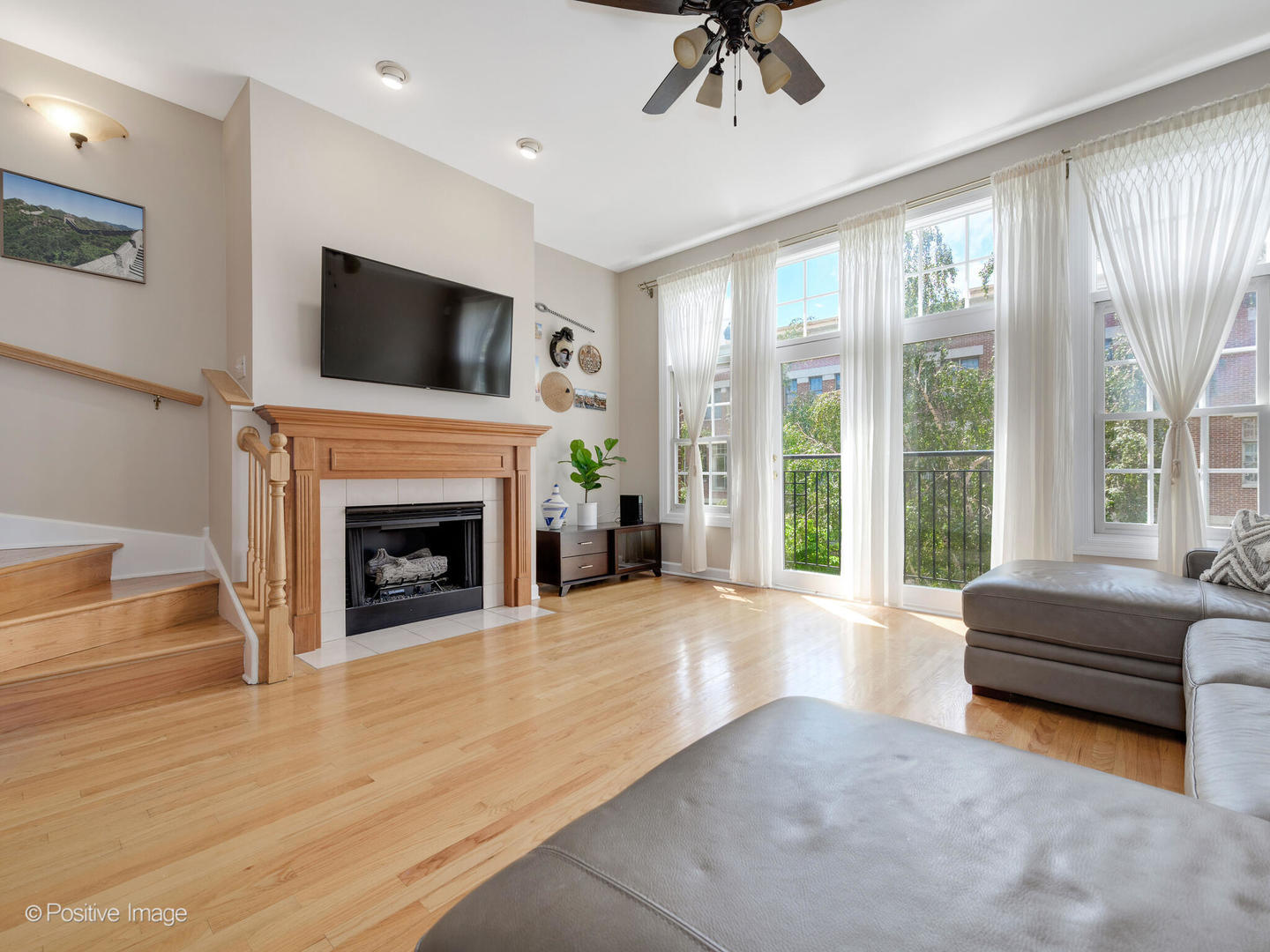 855 North May Street, Unit E Chicago, IL 60642 - Photo 5 of 30 a living room with furniture and a fireplace