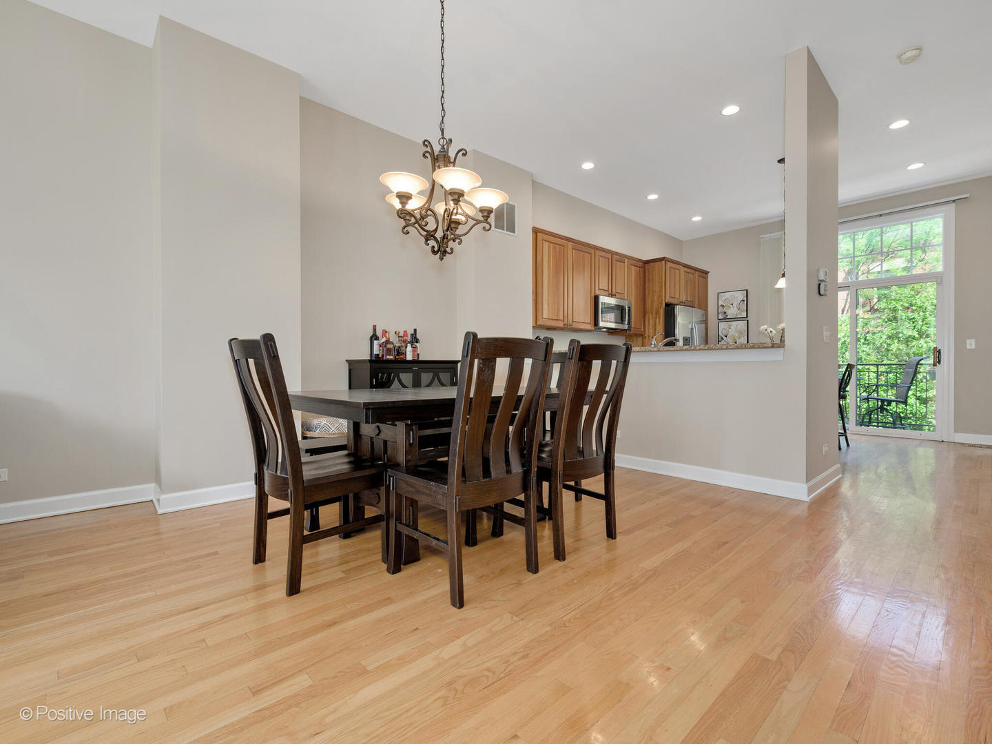 855 North May Street, Unit E Chicago, IL 60642 - Photo 7 of 30 a view of a dining room with furniture wooden floor and chandelier