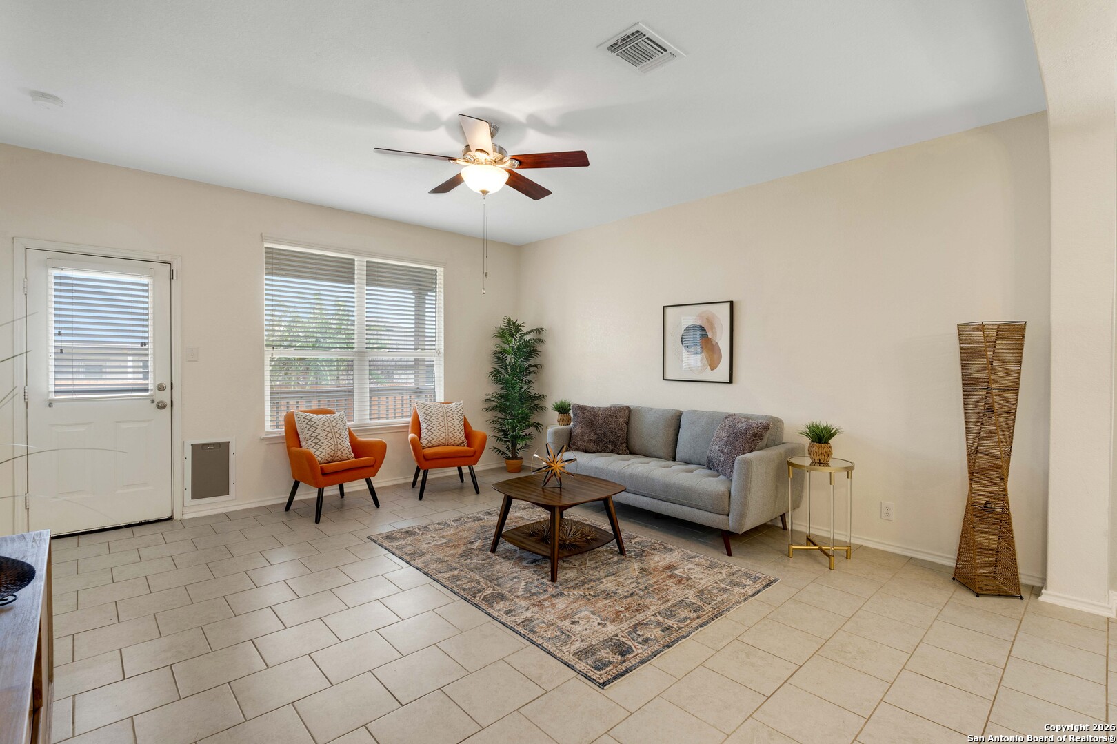 a living room with furniture and a window