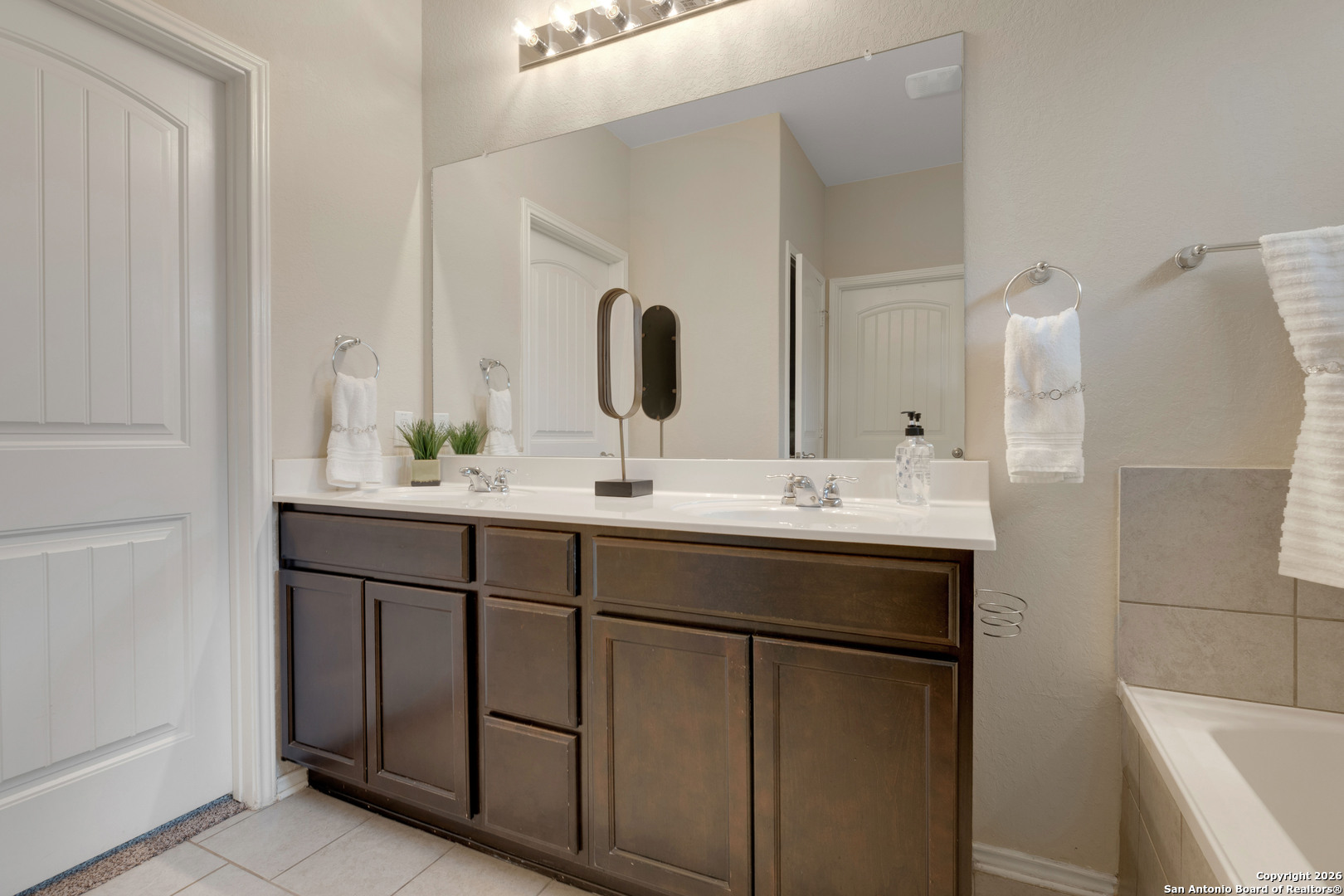428 Kings Way Cibolo, TX 78108 - Photo 17 of 30 a bathroom with a sink and a mirror