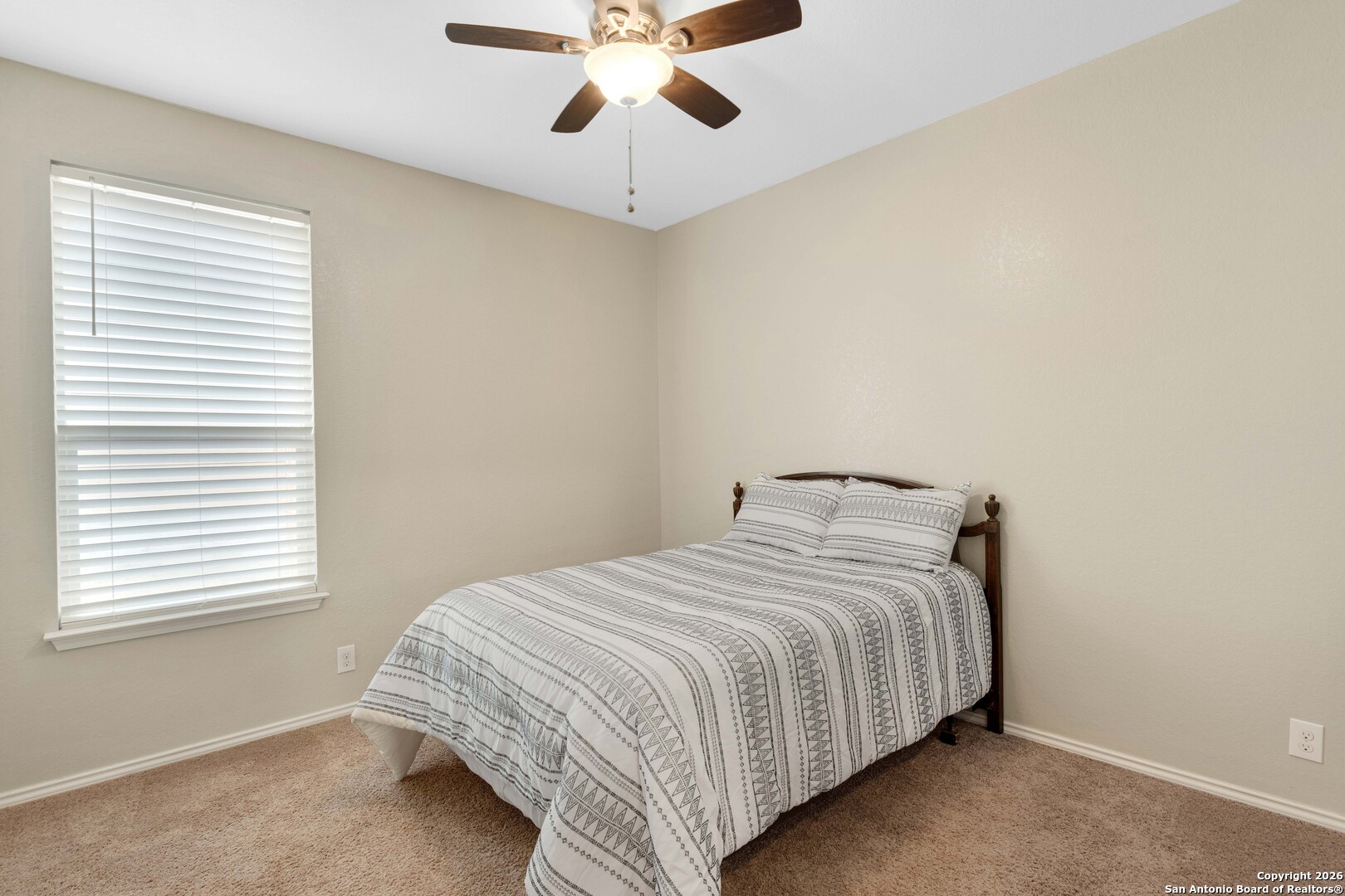 428 Kings Way Cibolo, TX 78108 - Photo 21 of 30 a bedroom with a bed and a chandelier