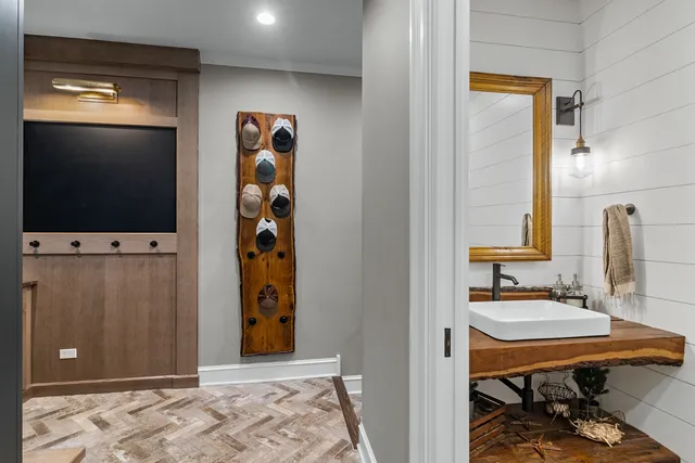 a view of a bathroom with a sink and mirror