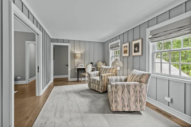 a living room with furniture and windows