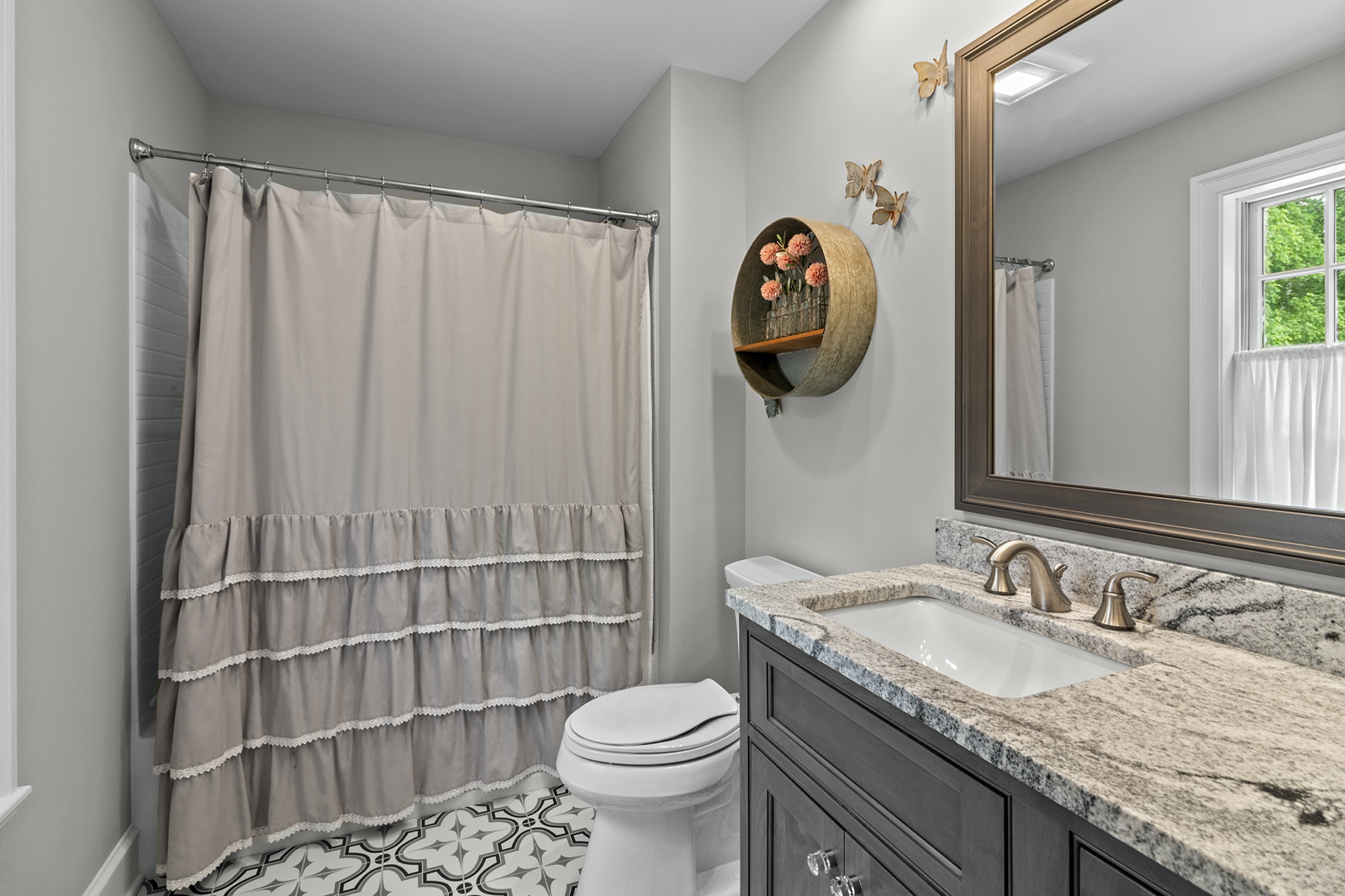 7208 White Oaks Road Harvard, IL 60033 - Photo 35 of 48 a bathroom with a granite countertop sink and a toilet